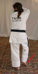 Turn head to look left towards B, pull front foot back, raise right arm to chamber position (facing outwards) with left arm on the outside (facing outwards)