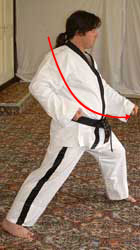6) Turn 90° left towards A hip twisting into a left walking stance whilst performing low block with left forearm