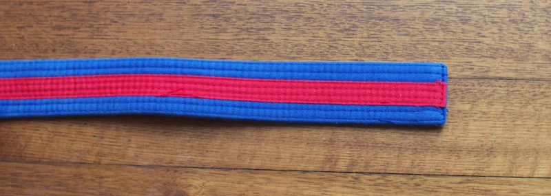 Blue with red tag belt