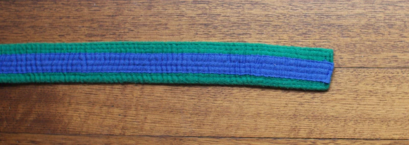 Green with blue tag belt